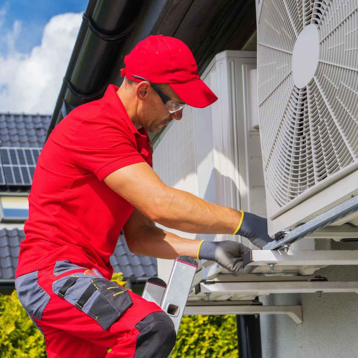 A Houston HVAC expert repairing an AC system